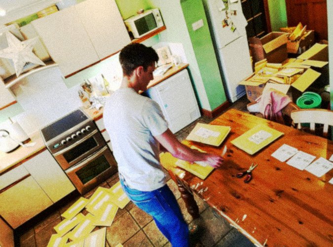 Early operations of The Face Mask Store UK, packing orders from a home kitchen